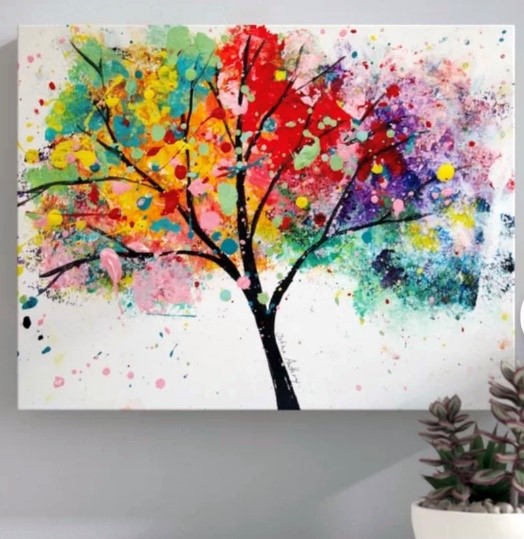 black tree trunk and branches with bright, multi-colored leaves on white background