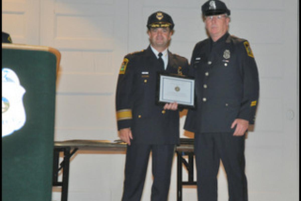 Officer of the Year Officer Robert Rohner and Chief Sansom